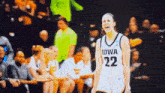 a basketball player with the number 22 on her jersey is screaming