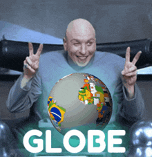 a man giving a peace sign with a globe in front of him that says globe