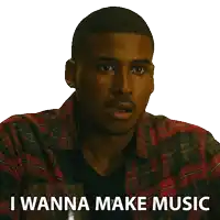 a man in a plaid shirt has the words i wanna make music on his face