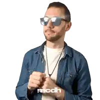 a man wearing sunglasses and a denim shirt has the letters mcdh on his arm