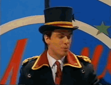 a man in a top hat and military uniform stands in front of a blue background