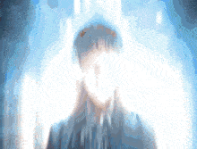 a blurred image of a person 's face with a blue background