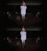 a woman in a white dress is standing in a bowling alley in the dark