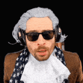 a man wearing a wig and sunglasses has headphones on his head