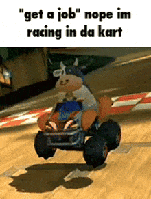 a cow is driving a go kart on a track .