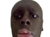 a close up of a man 's face with his eyes closed and his mouth open