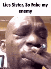 a man is crying with the words lies sister so fake my enemy below him