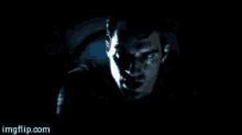 a dark room with a light coming out of the corner .