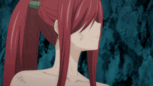 a close up of a woman 's face with red hair and a green ponytail