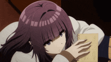 a girl with purple hair is laying down with her head resting on a notebook