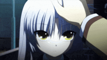 a person touching a girl 's head with a hand