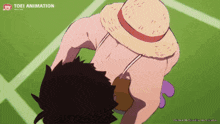a cartoon of a man wearing a straw hat with a toei animation logo in the corner