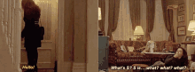 a woman walking in a hallway with the words hello written on the left