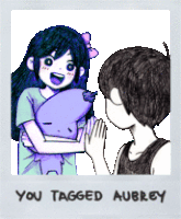 a picture of a girl holding a stuffed animal with the words you tagged aubrey written on it