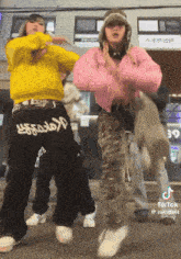 a group of people dancing in front of a building that says 39