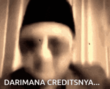 a man in a black hat with the words darimana creditsnya behind him