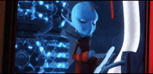 a blue alien in a red suit is using a computer .