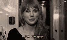 a woman says i love you guys in a black and white image