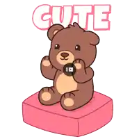 a brown teddy bear is sitting on a pink pillow with the word cute above it