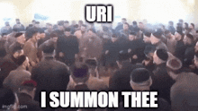 a large group of people are gathered in a room and dancing .