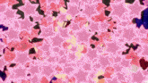 a bunch of pink stars on a dark background