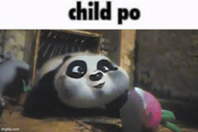 a panda bear from kung fu panda is laying down in a box and smiling .
