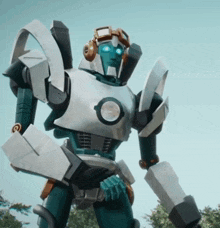 a robot wearing headphones and goggles stands in a field