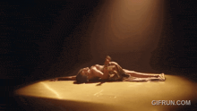 a gif from gifrun.com shows a woman laying on her back