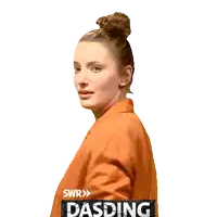 a woman with a bun on her head is standing in front of a sign that says dasding