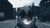 a man is riding a motorcycle down a street in a video game