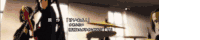 a blurred image of a drum set with chinese writing on the bottom left