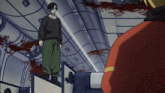 a man wearing a mask stands on a ledge in a room with blood on the floor