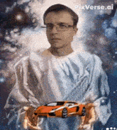 a man in a white robe is holding an orange car