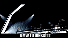 a man stands on a stage with the words omw to dinksttt written below him