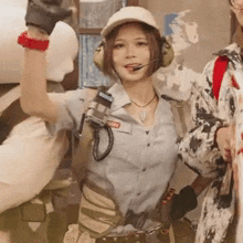 a woman wearing a hard hat and headphones has a name tag that says ' amanda ' on it