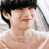 a close up of taehyung 's face with the words taehyung cuando ve a net