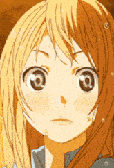 a close up of a girl 's face with a tear coming out of her eye
