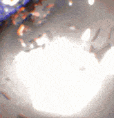 a blurred image of a white background with a few spots of light on it