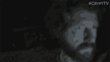 a blurry picture of a man 's face with #crypttv written on the bottom right