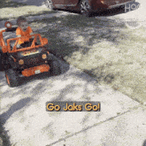 Go Jaks Go Happily GIF - Go Jaks Go Happily Riding A Children'S Car GIFs