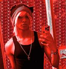 a man taking a picture of himself in a mirror