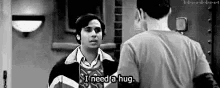 two men are standing next to each other and one of them is saying " i need a hug " .