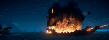 a pirate ship is on fire in the ocean