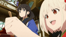 two anime girls are standing next to each other with one holding a stick