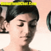 a close up of a woman 's face with her eyes closed and her mouth open .