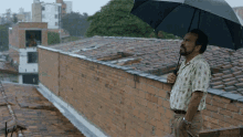 Out In The Rain GIF - Narcos Rain Umbrella GIFs