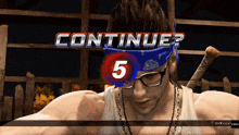 a man wearing glasses and a bandana is playing a video game called continue
