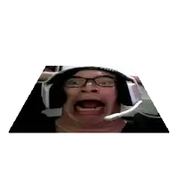 a man wearing glasses and headphones making a funny face