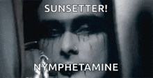 a black and white photo of a woman 's face with the words sunsetter nymphetamine written above her .