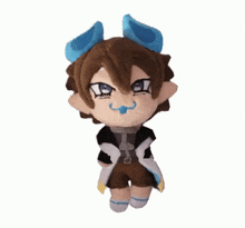 a stuffed animal with brown hair and blue ears has a pacifier in his mouth